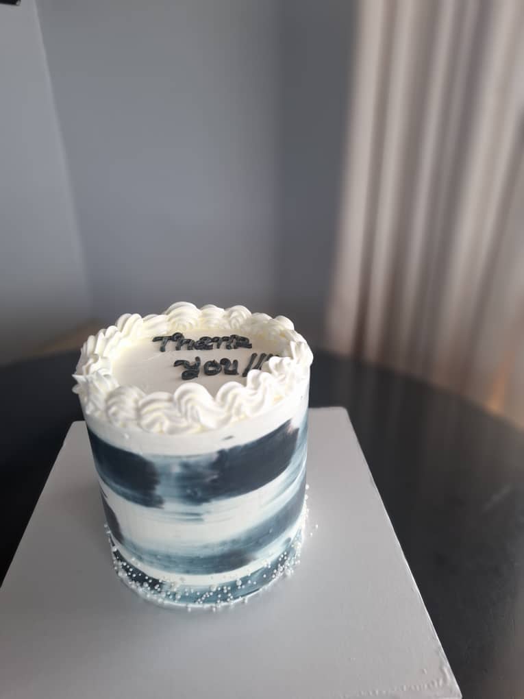 Blue and white painted thank you cake