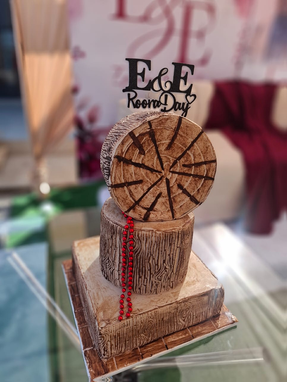 Wood-effect tiered wedding cake with custom topper